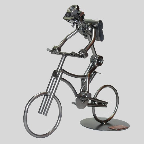 Schraubenmännchen Schüler auf Fahrrad Bild 1